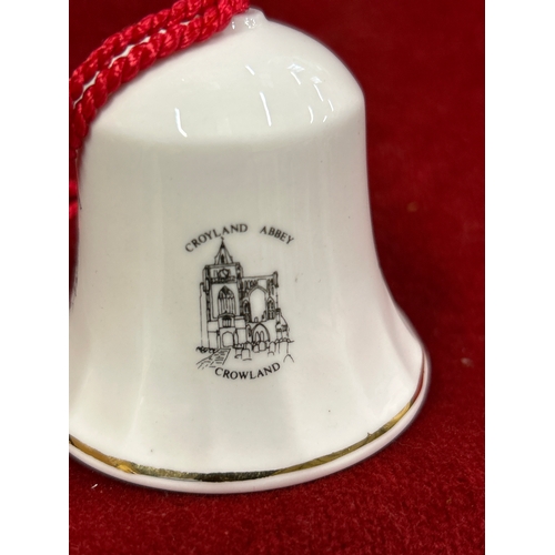 75 - Crowland Abbey, two porcelain bells by Allenway of Bourne England and 18 porcelain thimbles ‘Bone Ch... 