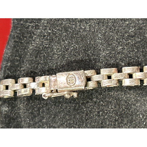 76 - Heavy sterling silver dolphin bangle and a sterling silver Cleopatra necklace. Total weight 75 grams