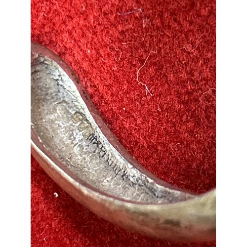 76 - Heavy sterling silver dolphin bangle and a sterling silver Cleopatra necklace. Total weight 75 grams