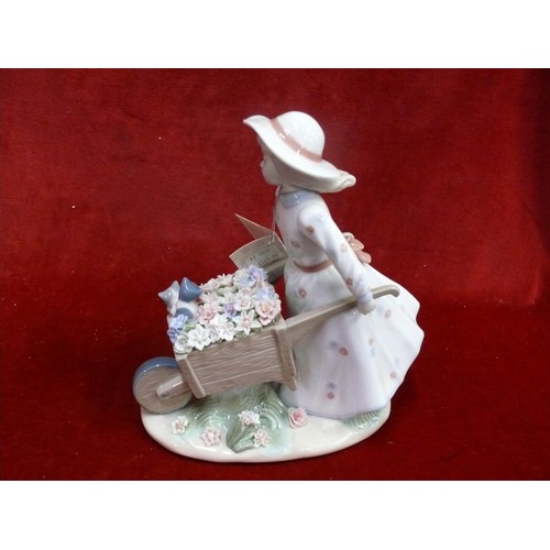 79B - Nadal Spanish porcelain figurine of a girl pushing a wheelbarrow, new with box and packaging