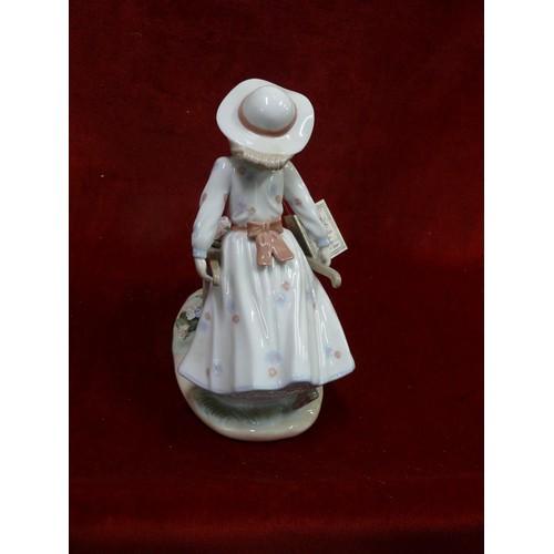 79B - Nadal Spanish porcelain figurine of a girl pushing a wheelbarrow, new with box and packaging
