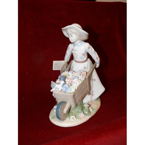 79B - Nadal Spanish porcelain figurine of a girl pushing a wheelbarrow, new with box and packaging