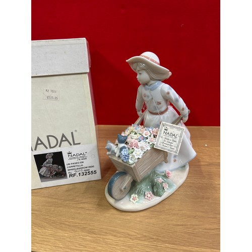 79B - Nadal Spanish porcelain figurine of a girl pushing a wheelbarrow, new with box and packaging