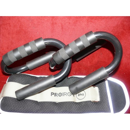 221 - A pair of push up bars and a pair of weighted straps