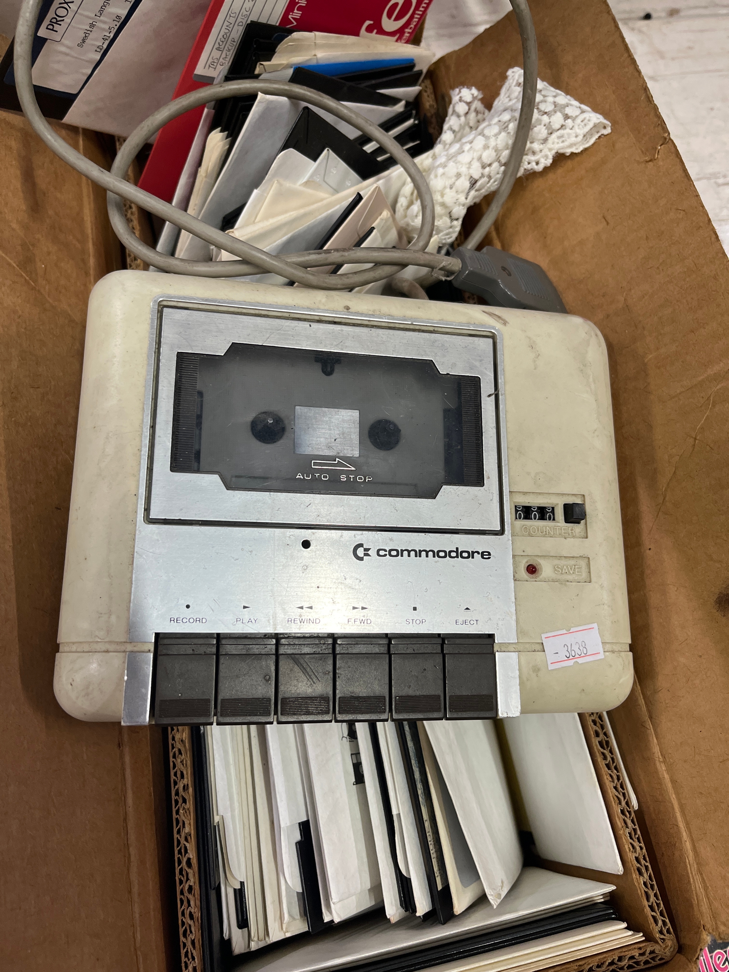 Commodore C2N cassette, serial no 1603016 plus a selection of floppy discs