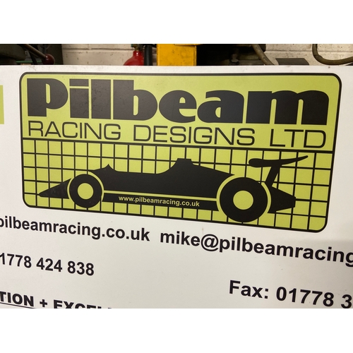 52 - Pilbeam Racing Designs Ltd promotional board - “Innovation + Excellence = The Winning Formula”. Depi... 