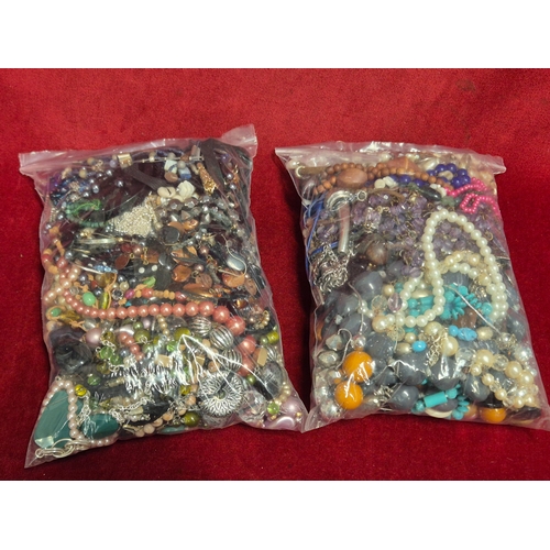 66 - 2 large bags of mixed costume jewellery