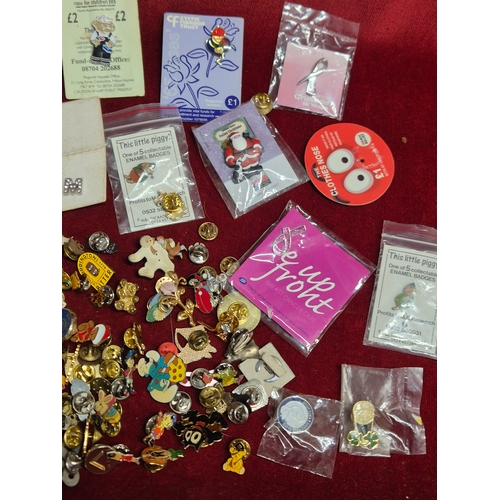 76 - Tin of various pin badges