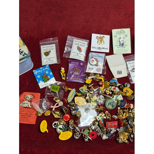 76 - Tin of various pin badges
