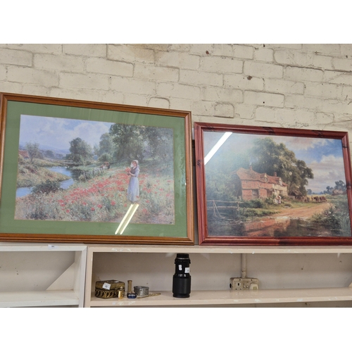 86 - A large framed print of a country scene with figures in a field of poppies by Ernst Wilburn 1872 to ... 