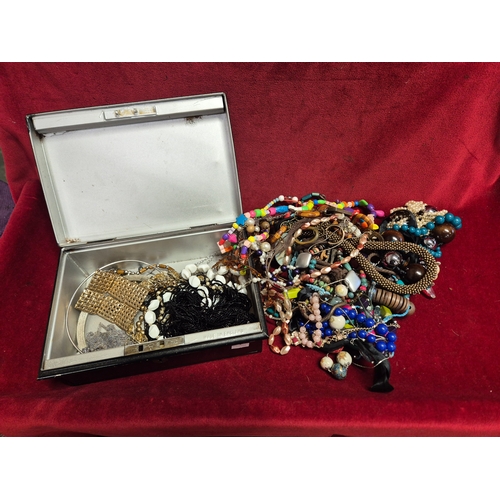 100 - Vintage cash tin with contents of costume jewellery