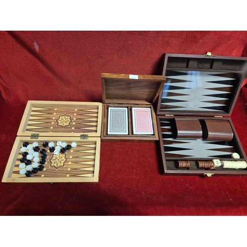 102 - 3 decorative gaming boxes, 2 in wood with contents of playing cards and Backgammon pieces