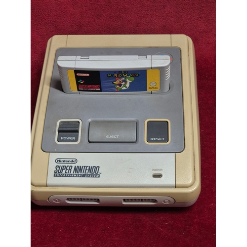 103 - SNES Super Nintendo Entertainment System with Super Mario World game, controllers and power supply