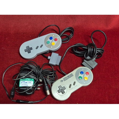 103 - SNES Super Nintendo Entertainment System with Super Mario World game, controllers and power supply