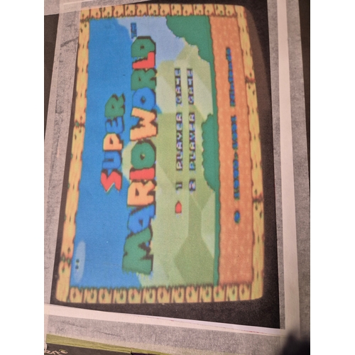 103 - SNES Super Nintendo Entertainment System with Super Mario World game, controllers and power supply