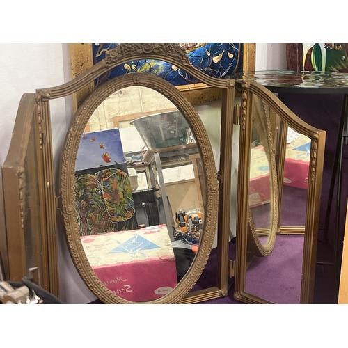 136 - Large Ornate triple folding mirror with tilting oval centre mirror