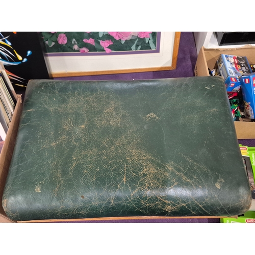 111 - Large footstool with green distressed leather top and solid oak bun feet