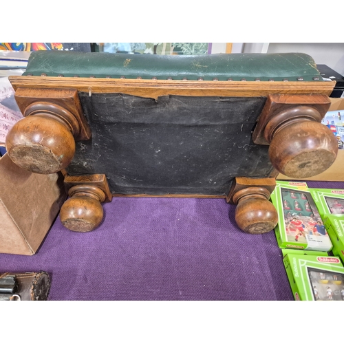 111 - Large footstool with green distressed leather top and solid oak bun feet