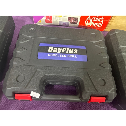 152 - DayPlus cordless hammer drill, new in case