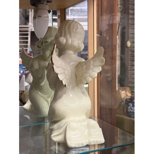 194 - Large ceramic angel figure - ivory colour with gilt wing tips. 28cm