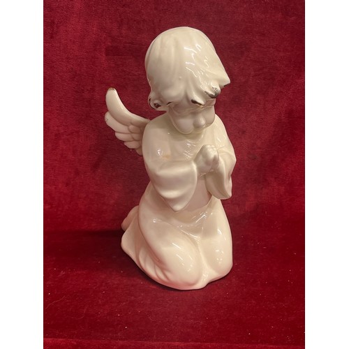 194 - Large ceramic angel figure - ivory colour with gilt wing tips. 28cm