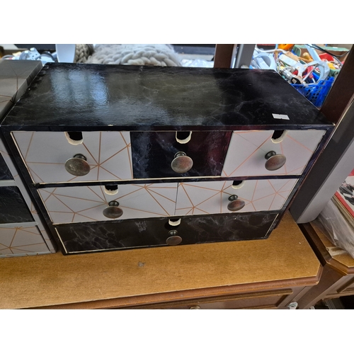 195 - 2 small sets of drawers with geometric design pattern