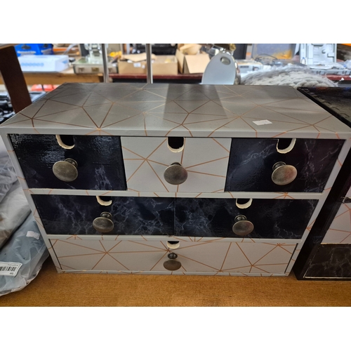195 - 2 small sets of drawers with geometric design pattern