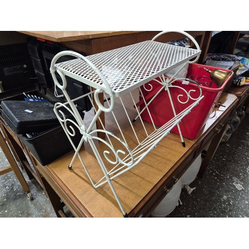 207 - Metal magazine rack side table and a box of mostly glass tankards etc plus some brass
