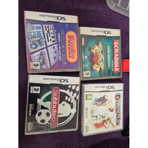 Plastic box with contents of Nintendo DS games