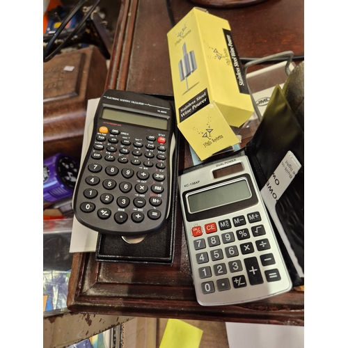 257 - Collection of stationery to include a Vintage hole punch, scientific calculator and a dual power cal... 