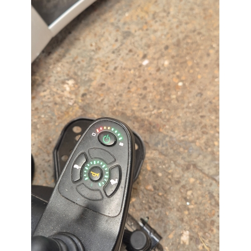 61 - Electric wheelchair with charger, in working order