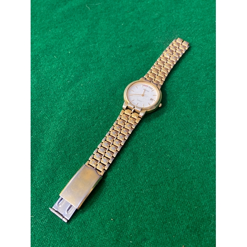 16 - Vintage Accurist quartz day-date wristwatch, with white dial and gold tone stainless steel strap. On... 