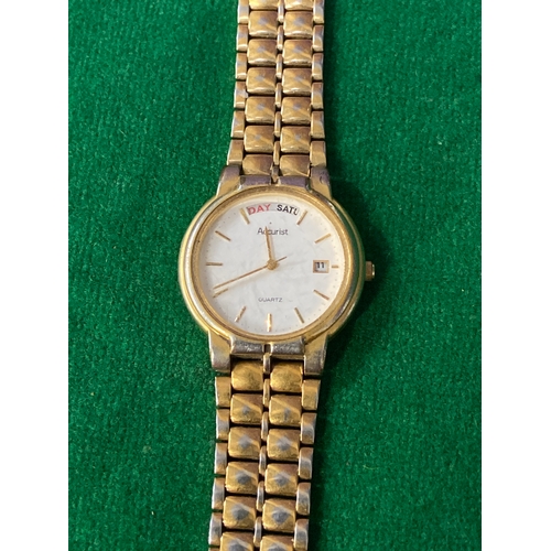 16 - Vintage Accurist quartz day-date wristwatch, with white dial and gold tone stainless steel strap. On... 