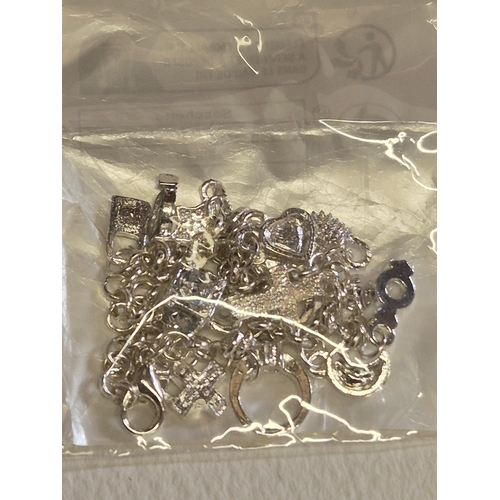 42 - 3 packs of white metal charms