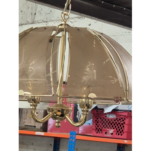 188 - Vintage chandelier featuring a polished brass frame with smoky glass
