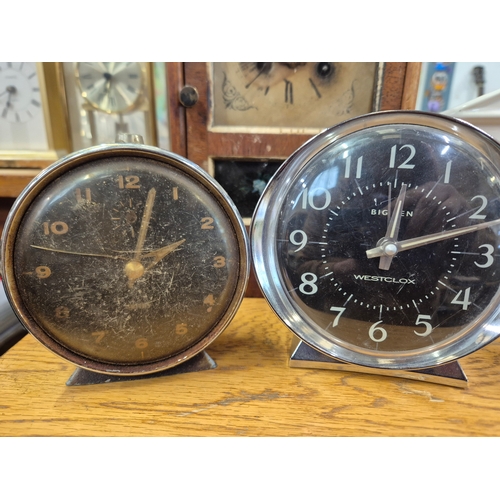 264 - Antique wooden steeple mantle clock plus Smiths and Big Ben alarm clocks, West German dome clock and... 