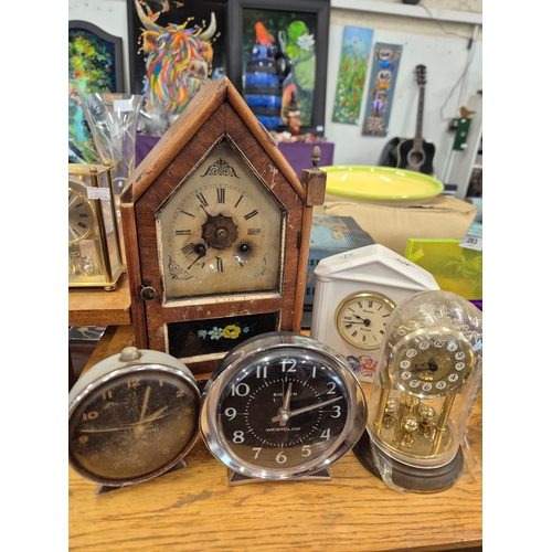 264 - Antique wooden steeple mantle clock plus Smiths and Big Ben alarm clocks, West German dome clock and... 