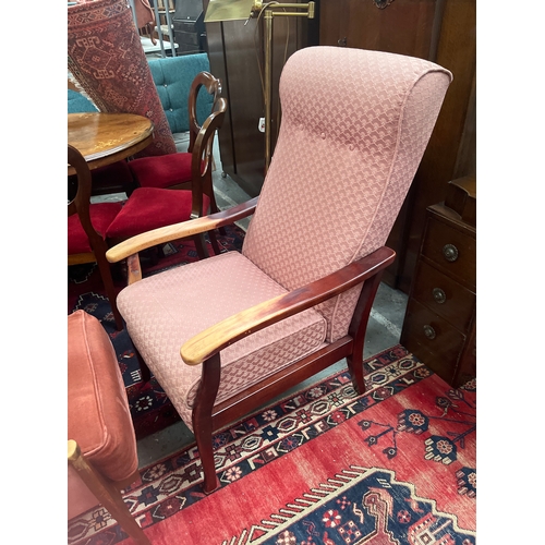 306 - Parker knoll high back chair with wooden arms and upholstered in  pink shell style fabric