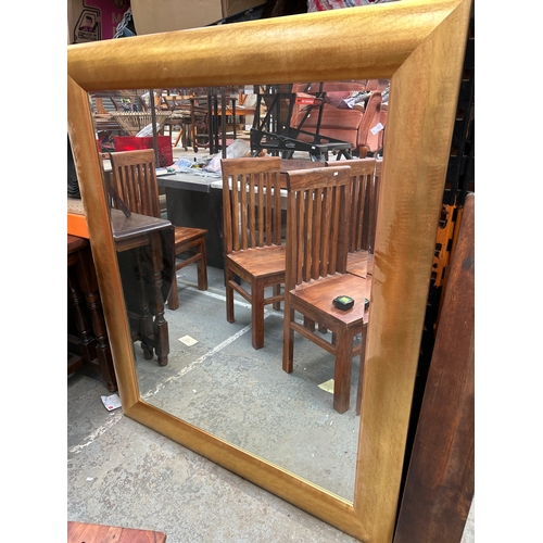 321A - Very large contemporary style gilt framed mirror with bevelled glass & wide cushion frame. 54” x 44”