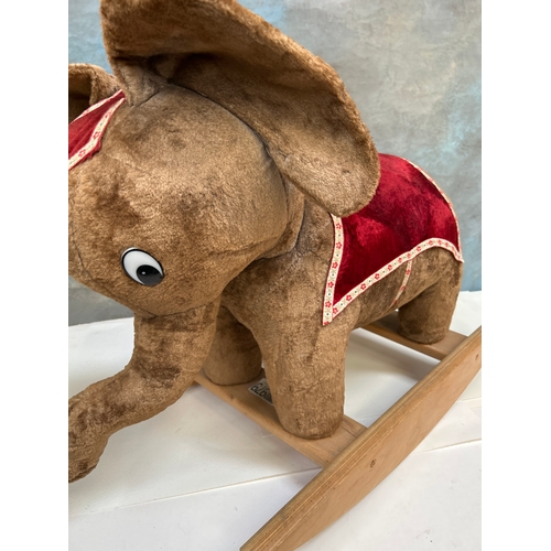 330 - Vintage circus elephant ride on toy 80cm x 55cm. Back right leg needs repair. Teddy bear for scale.