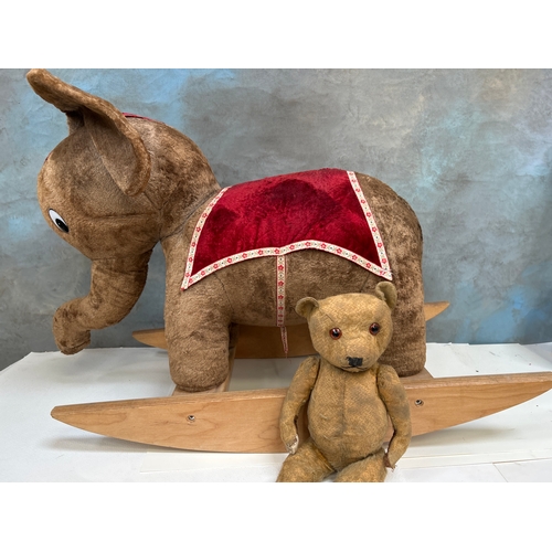 330 - Vintage circus elephant ride on toy 80cm x 55cm. Back right leg needs repair. Teddy bear for scale.