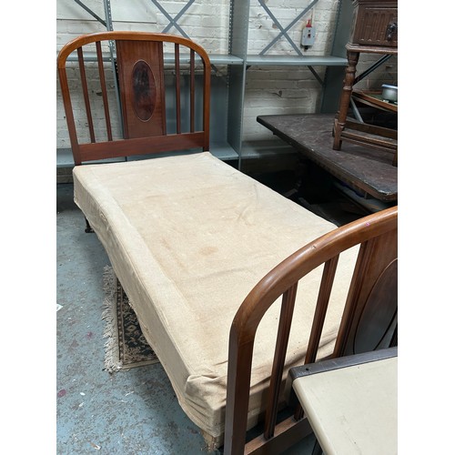 331 - Edwardian mahogany single bed, with cast iron  rails, casters and the original sprung horse hair bas... 