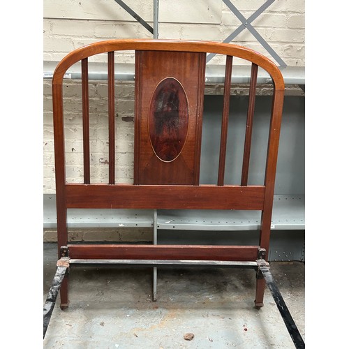 331 - Edwardian mahogany single bed, with cast iron  rails, casters and the original sprung horse hair bas... 