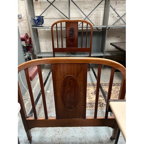331 - Edwardian mahogany single bed, with cast iron  rails, casters and the original sprung horse hair bas... 