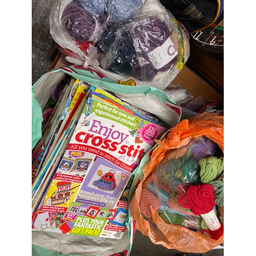 362 - Quantity of crafting -cross stitch magazines & also tapestry wool & knitting wool.