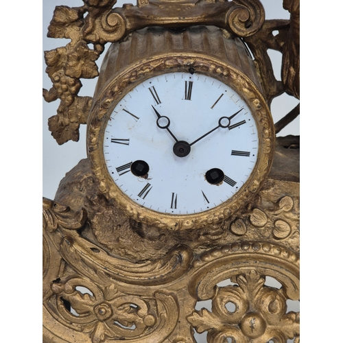 162 - French gilt metal or ormolu mantel clock featuring a figural surmount of a child with grapes, needs ... 