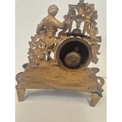 162 - French gilt metal or ormolu mantel clock featuring a figural surmount of a child with grapes, needs ... 