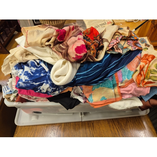 410 - Large lidded box of mixed clothing and scarves