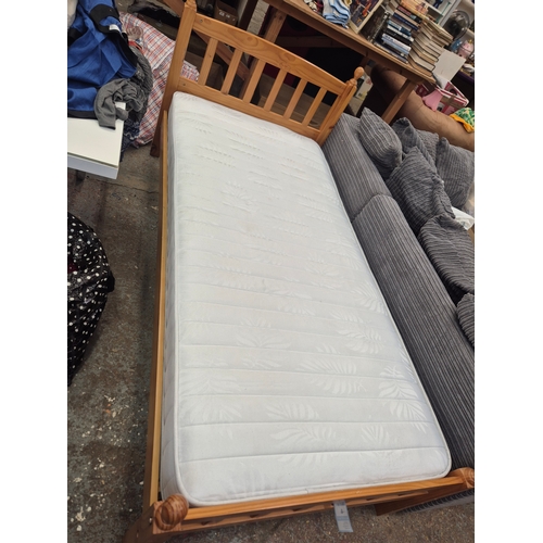 424 - Pine framed single bed with clean mattress by Dreams