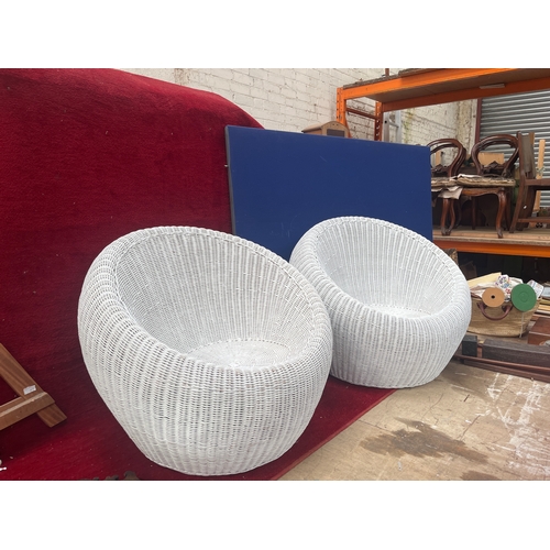 399A - Pair of 1970’s rattan pod chairs in white finish